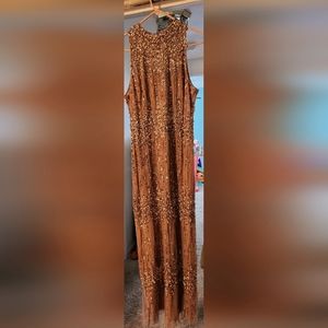 Is embellished rose gold evening gown